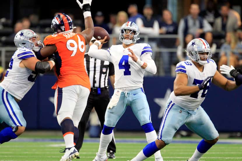 Dallas Cowboys quarterback Dak Prescott (4) throws a pass during the second half of an NFL...