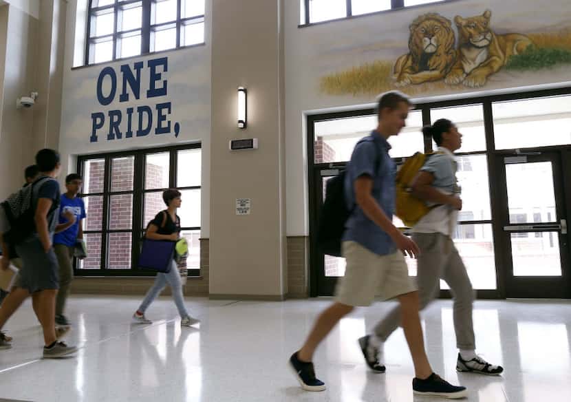  Students make their way to their next class during the first day of class at Reedy High...
