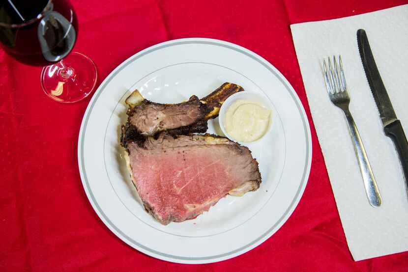 A single serving of a crown roast paired with horseradish sauce 