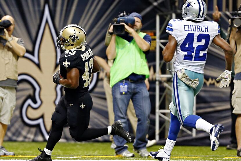 New Orleans Saints running back Darren Sproles (43) stays ahead of Dallas Cowboys free...