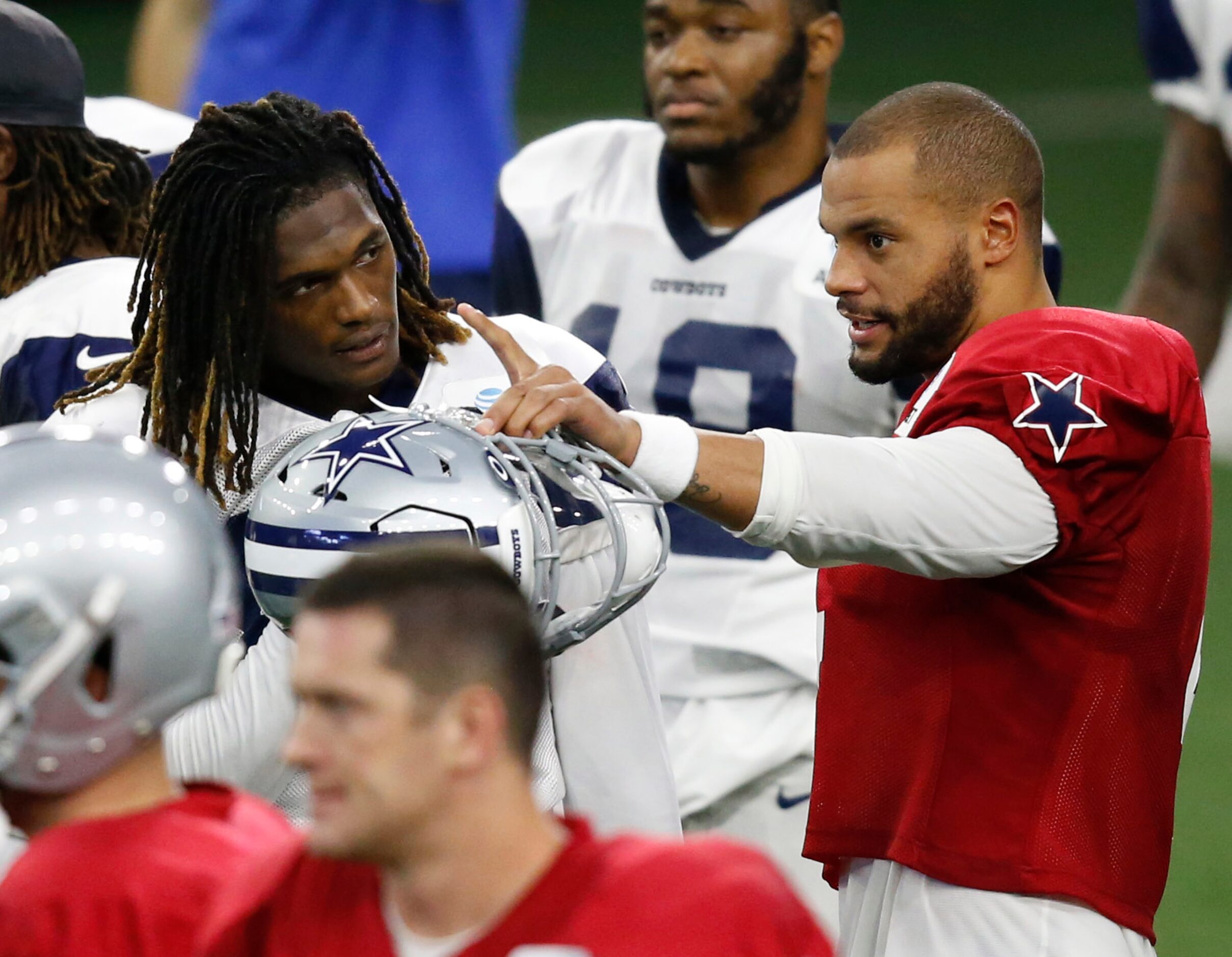 Dallas Cowboys quarterback Dak Prescott (4) talks to Dallas Cowboys wide receiver CeeDee...