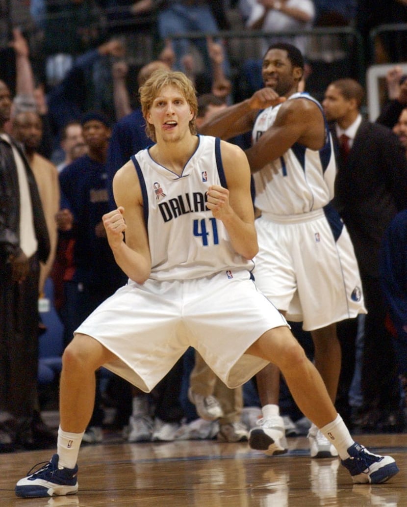 Dallas Mavericks' Dirk Nowitzki (41) reacts after scoring in the final seconds of the game...