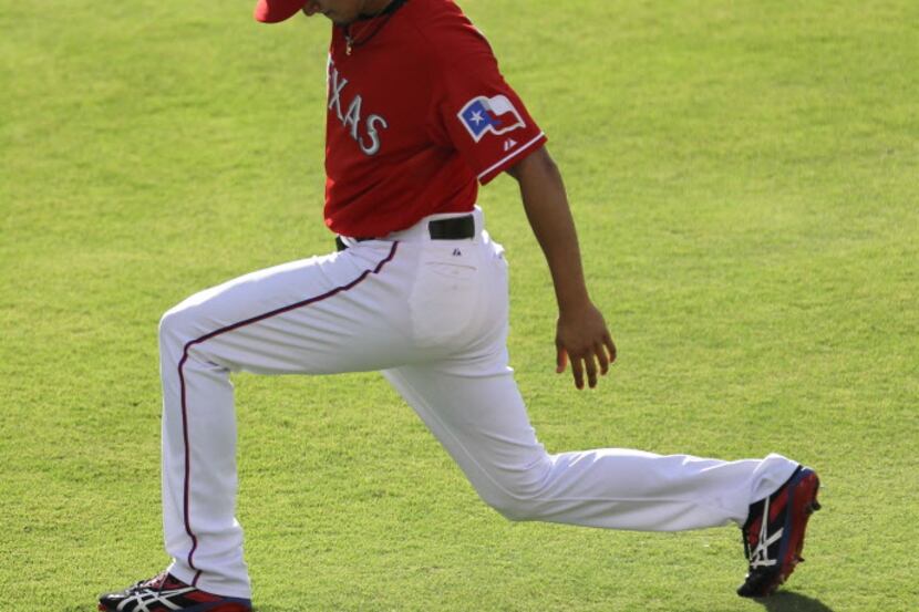 Texas Rangers starting pitcher Yu Darvish (11) loosens up before his start in the Toronto...