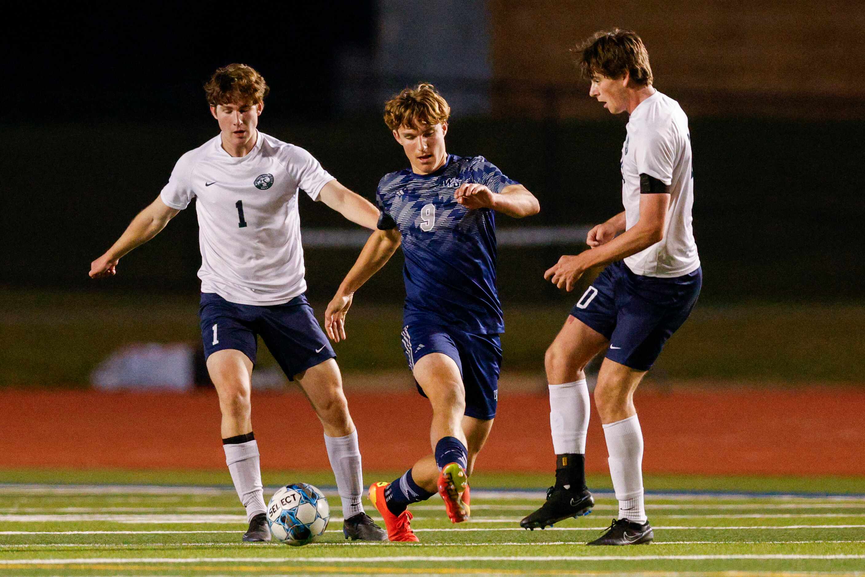 Frisco Reedy's David Fox (1) and Grant McGowan (20) defend against Prosper Walnut Grove...