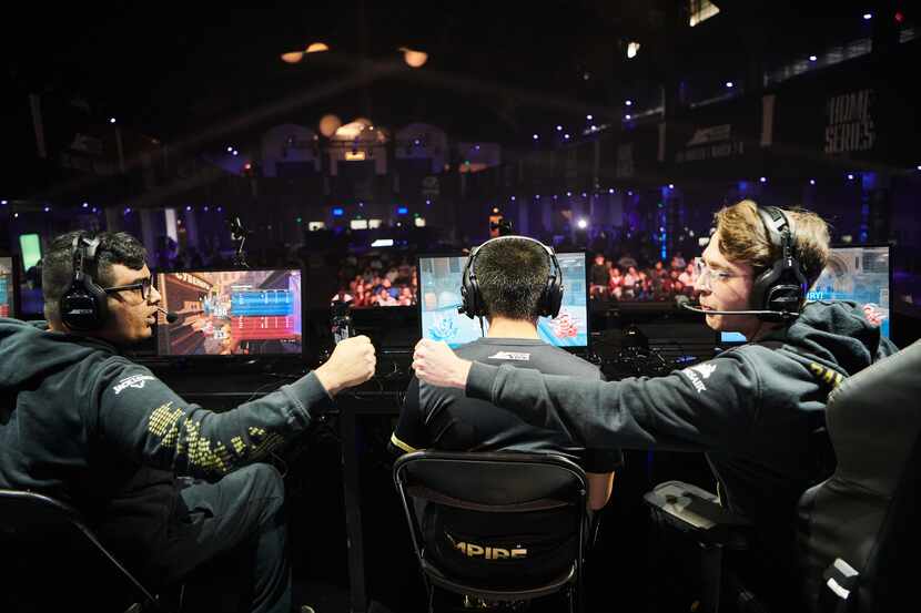 Dallas Empire teammates congratulate each other at the Call of Duty League home series event...