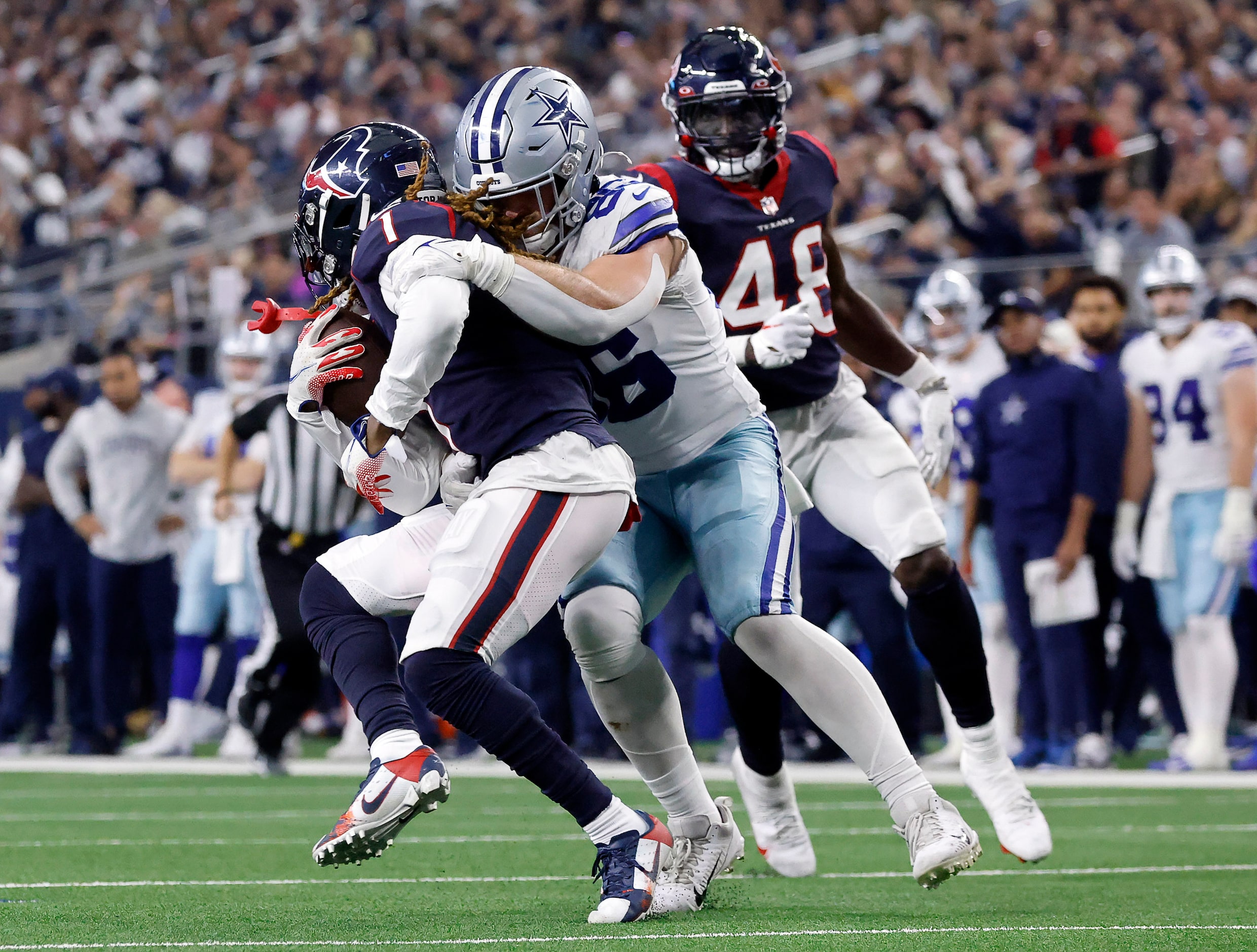 Dallas Cowboys tight end Dalton Schultz (86) tackles Houston Texans cornerback Tremon Smith...