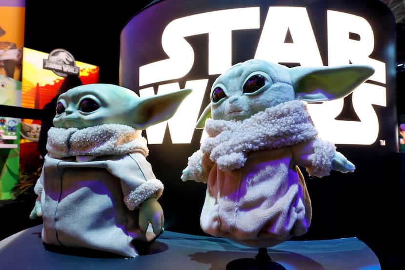 A pair of Baby Yoda dolls, by Mattel, were displayed at Toy Fair New York, in the Javits...