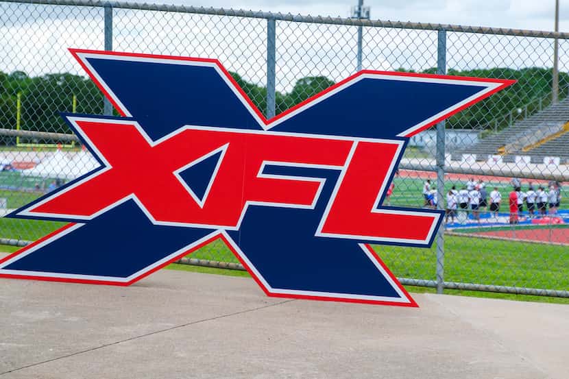 A logo is displayed at a stadium entrance during tryouts for the new Dallas XFL pro football...