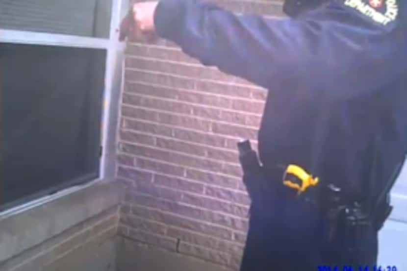  A screenshot from the body-worn camera video showing Dallas police fatally shooting a...