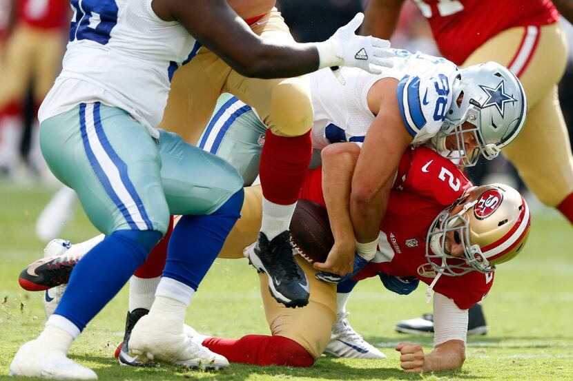 Dallas Cowboys defensive tackle Tyrone Crawford (98) sacks San Francisco 49ers quarterback...
