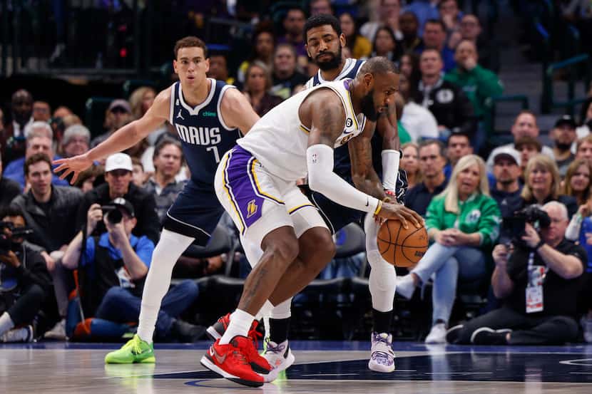Dallas Mavericks guard Kyrie Irving (2) defends against Los Angeles Lakers forward LeBron...