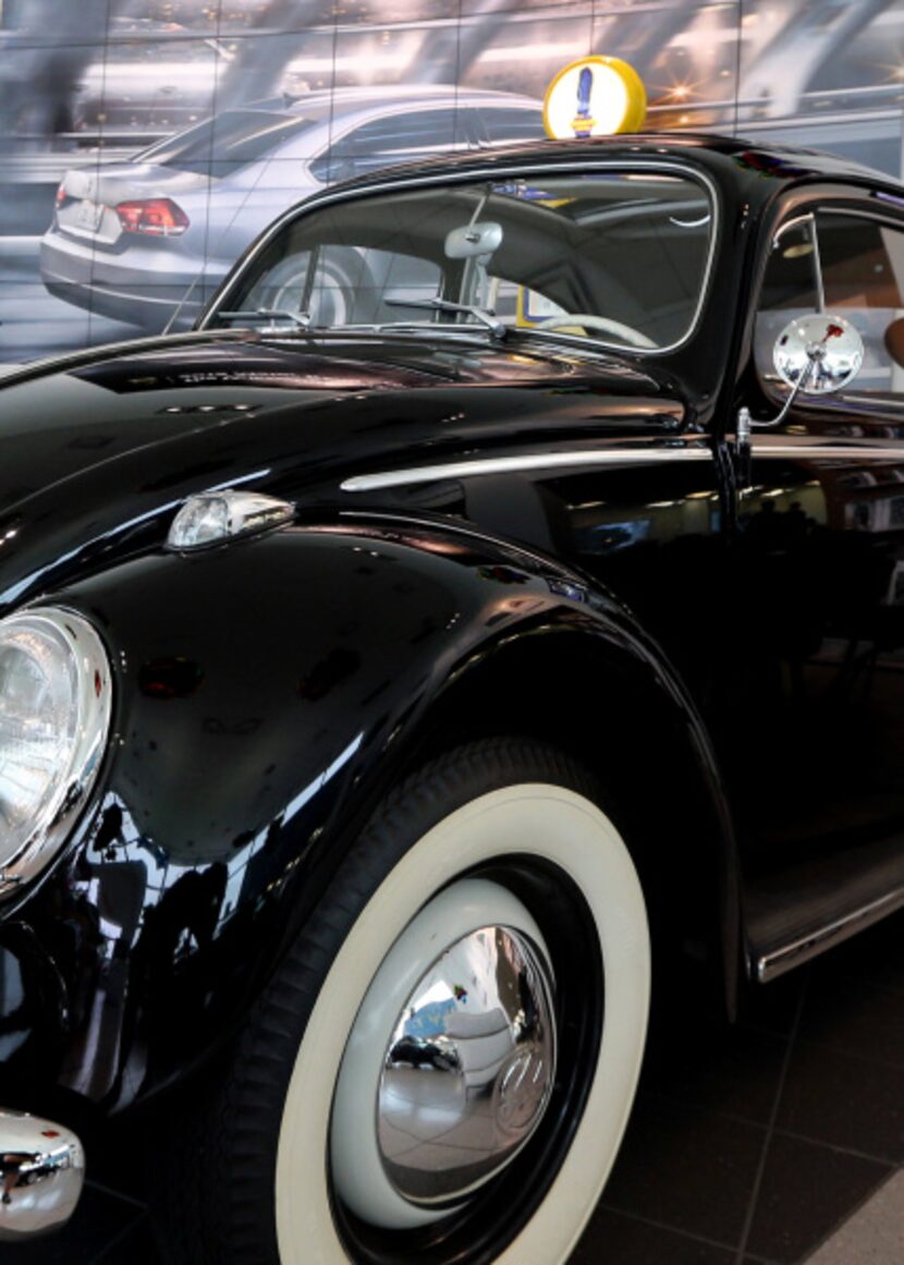 A 1960s-era Beetle on the showroom floor provides inspiration to the staff at Lewisville...