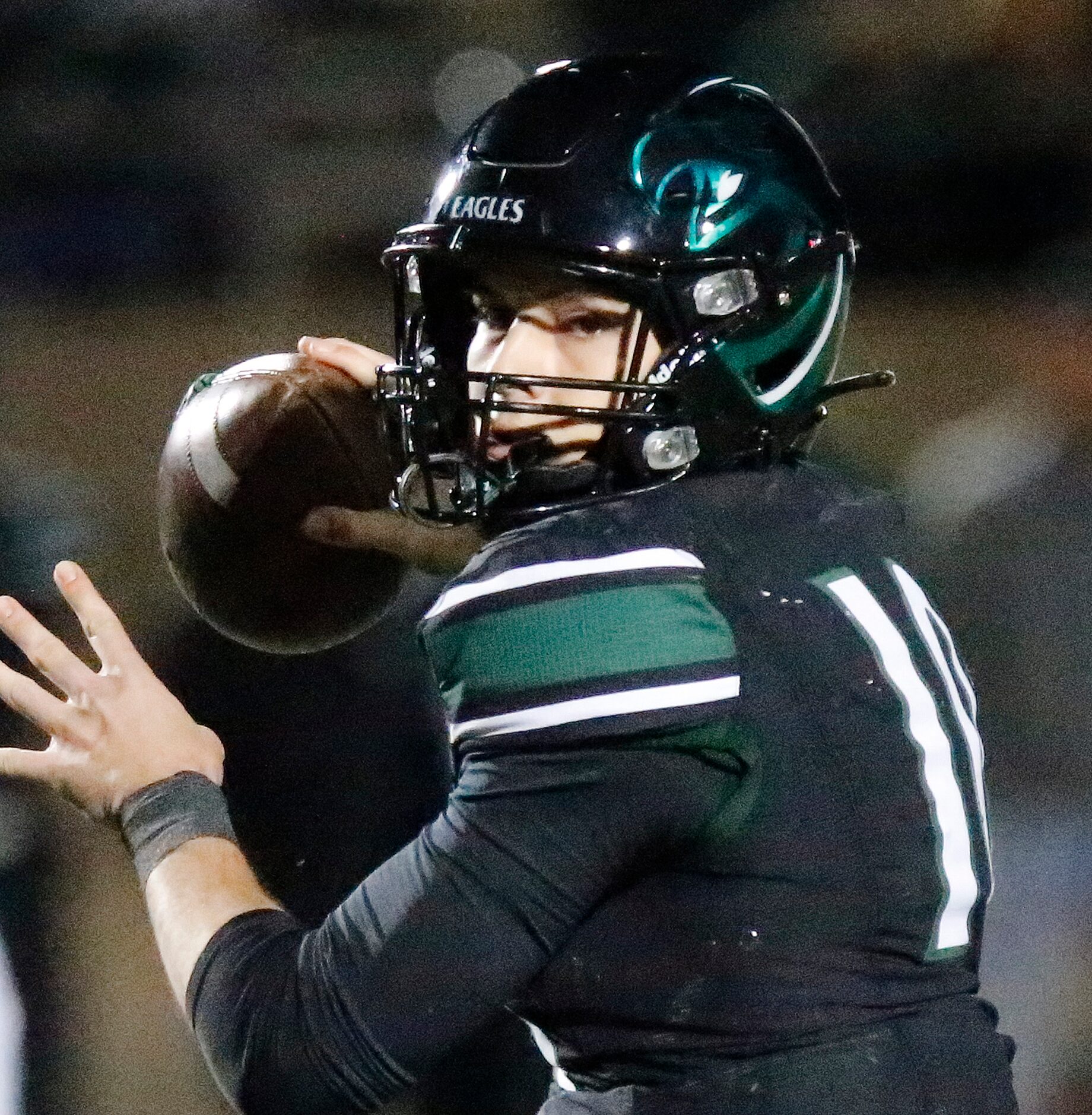 Prosper High School quarterback Harrison Rosar (10) throws a pass during the first half as...