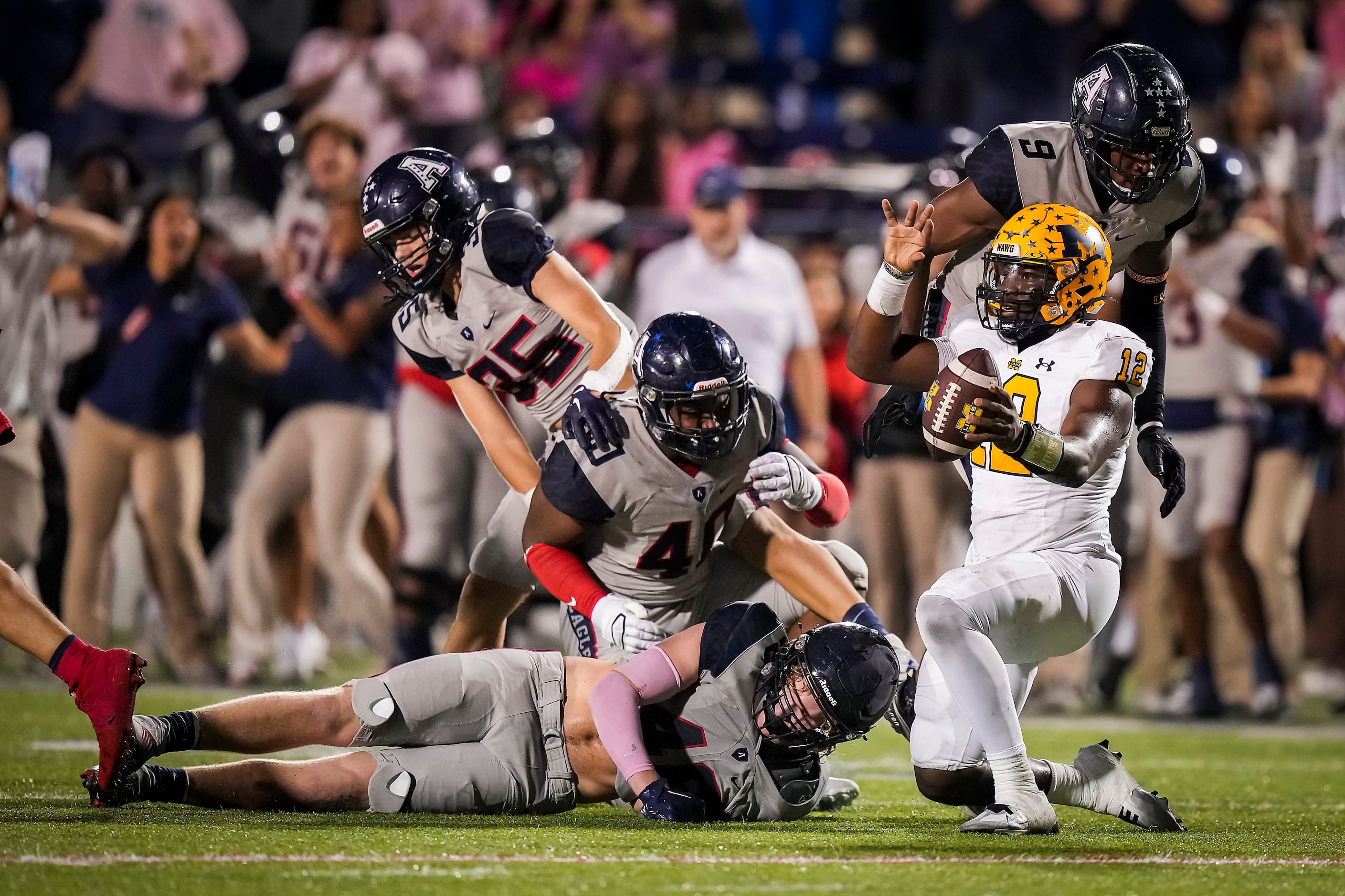 McKinney quarterback Keldric Luster (12) reacts after being stopped on a fourth down play...