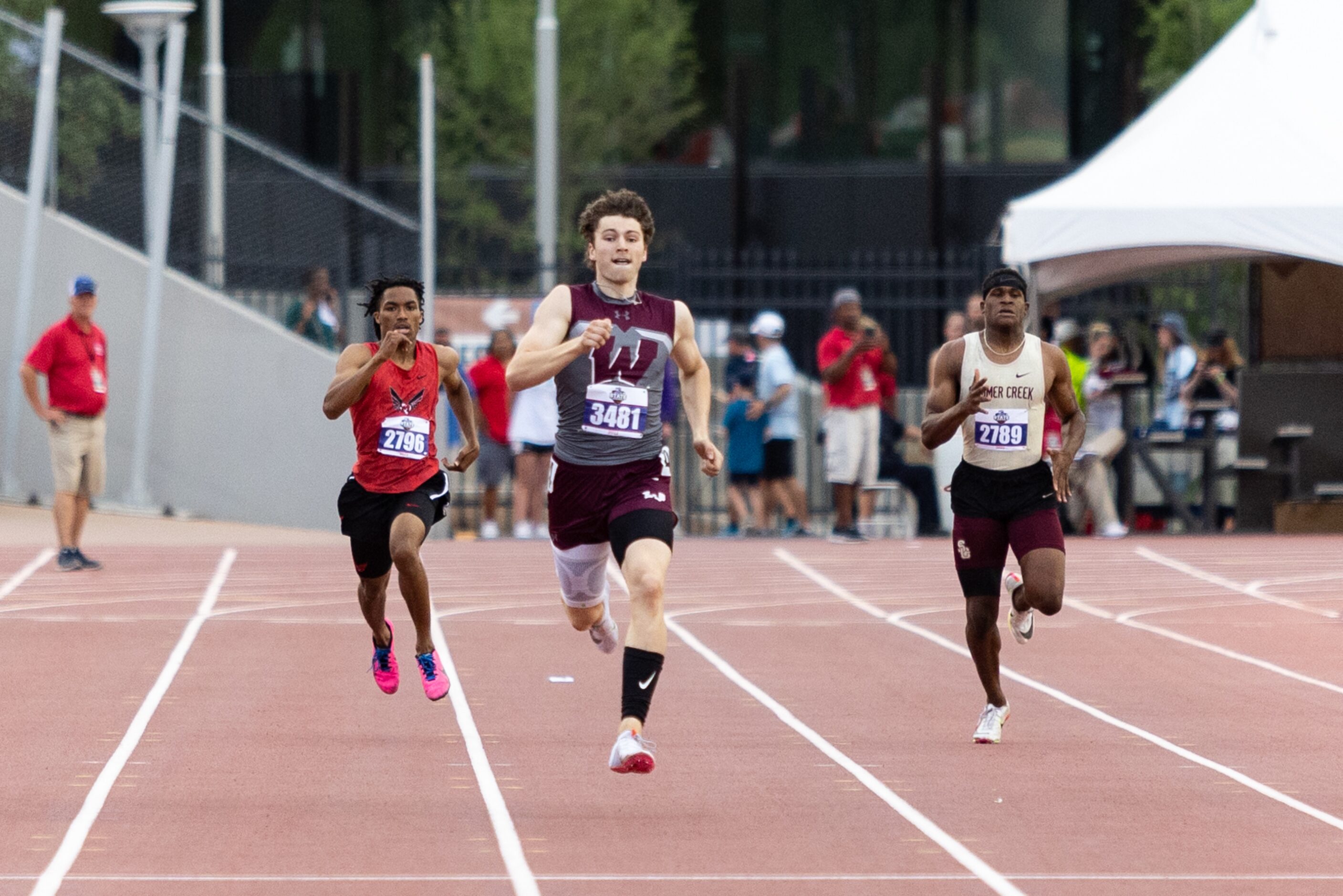 Logan Popelka, center, of Wylie sprints to the finish in the boys’ 400-meter dash at the UIL...