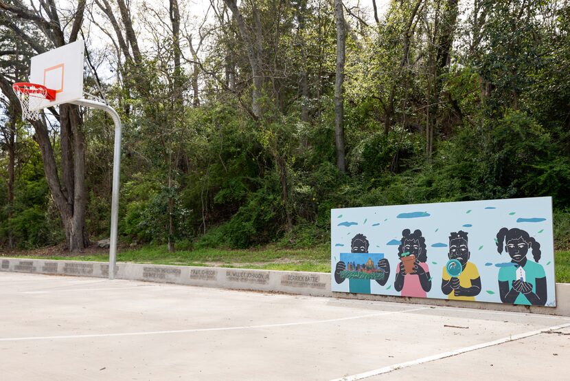 A mural stands alongside the basketball court at South Oak Cliff Renaissance Park in Dallas....