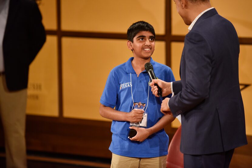 Abhijay Kodali, of Denton County, reacts with a smile as he's interviewed by WFAA news...