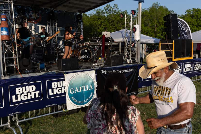 Elvira Hernandez and Mike Lara dance together to the live music at Garland’s Cinco De Mayo...