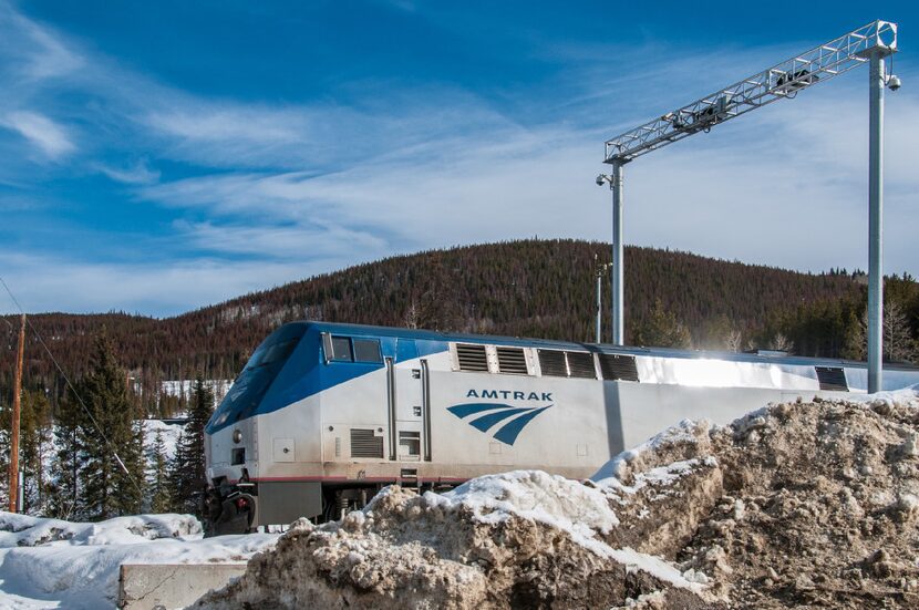 An Amtrak train emerges from the 6.2-mile-long Moffat Tunnel.  After a seven-season absence,...