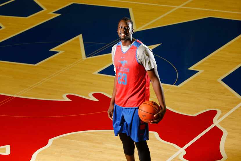 Akoy Agau poses for a portrait in Moody Coliseum at SMU in Dallas on Oct. 30, 2017. Agau is...