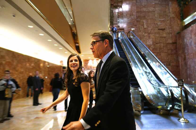 Former Texas Governor Rick Perry, walking through the lobby of Trump Tower, once called...