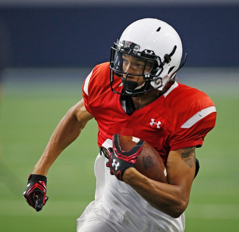 Texas Tech's Antoine Wesley carries during the NCAA college football team's spring game...