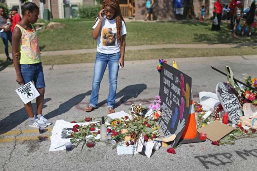 
Lakiah Payne (left) and Deja Brown, the sister of shooting victim Michael Brown, visited a...