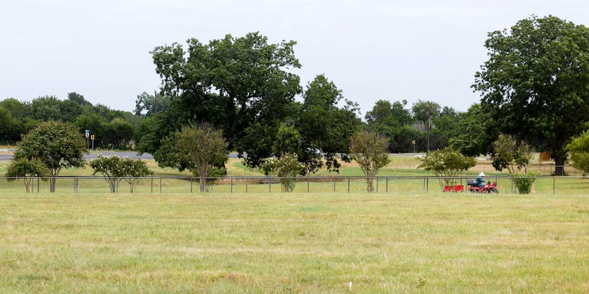 David Thompson drives a 4-wheeler down the main road on his and Karen Thompson’s land in...