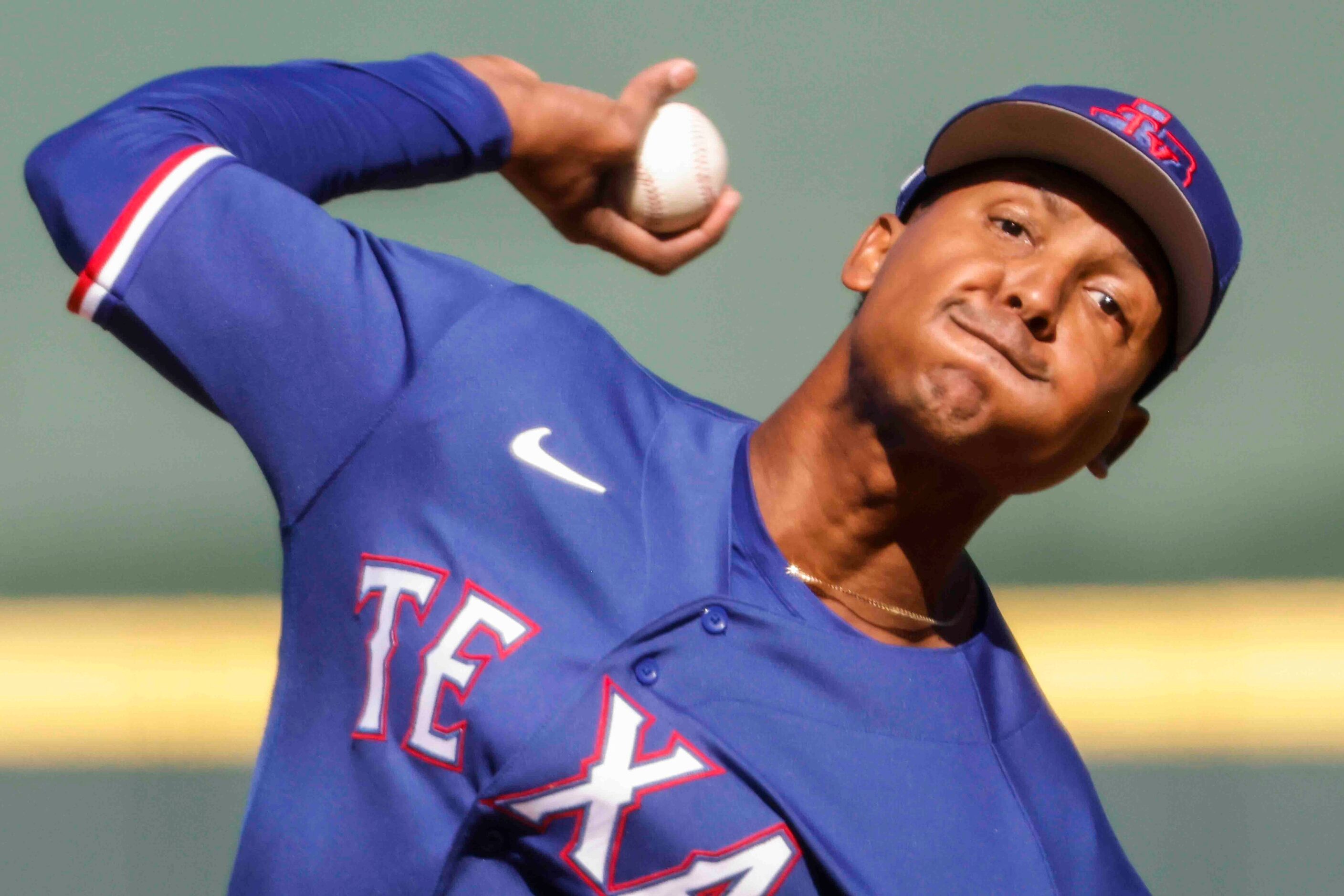 Texas Rangers Jose Leclerc delivers a pitch during the fourth inning of a spring training...