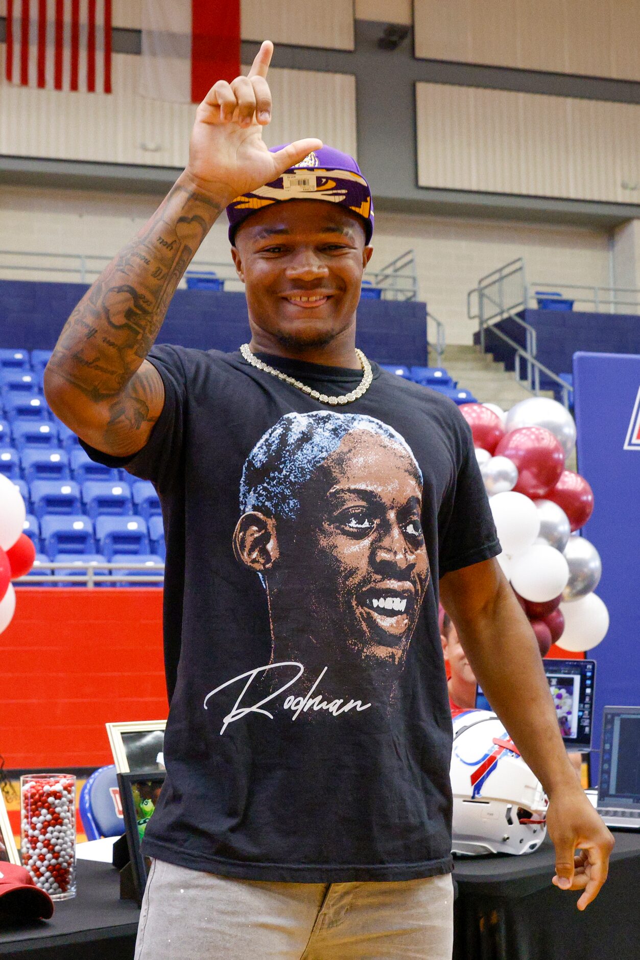 Duncanville running back Caden Durham holds up an “L” after choosing LSU during a commitment...