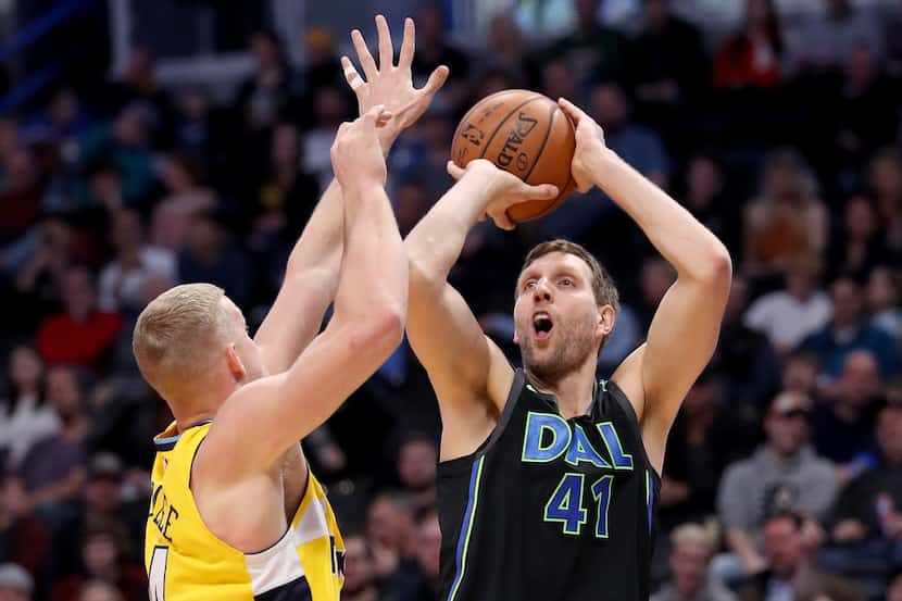 DENVER, CO - JANUARY 27:  Dirk Nowitzki #41 of the Dallas Mavericks puts up a shot over...