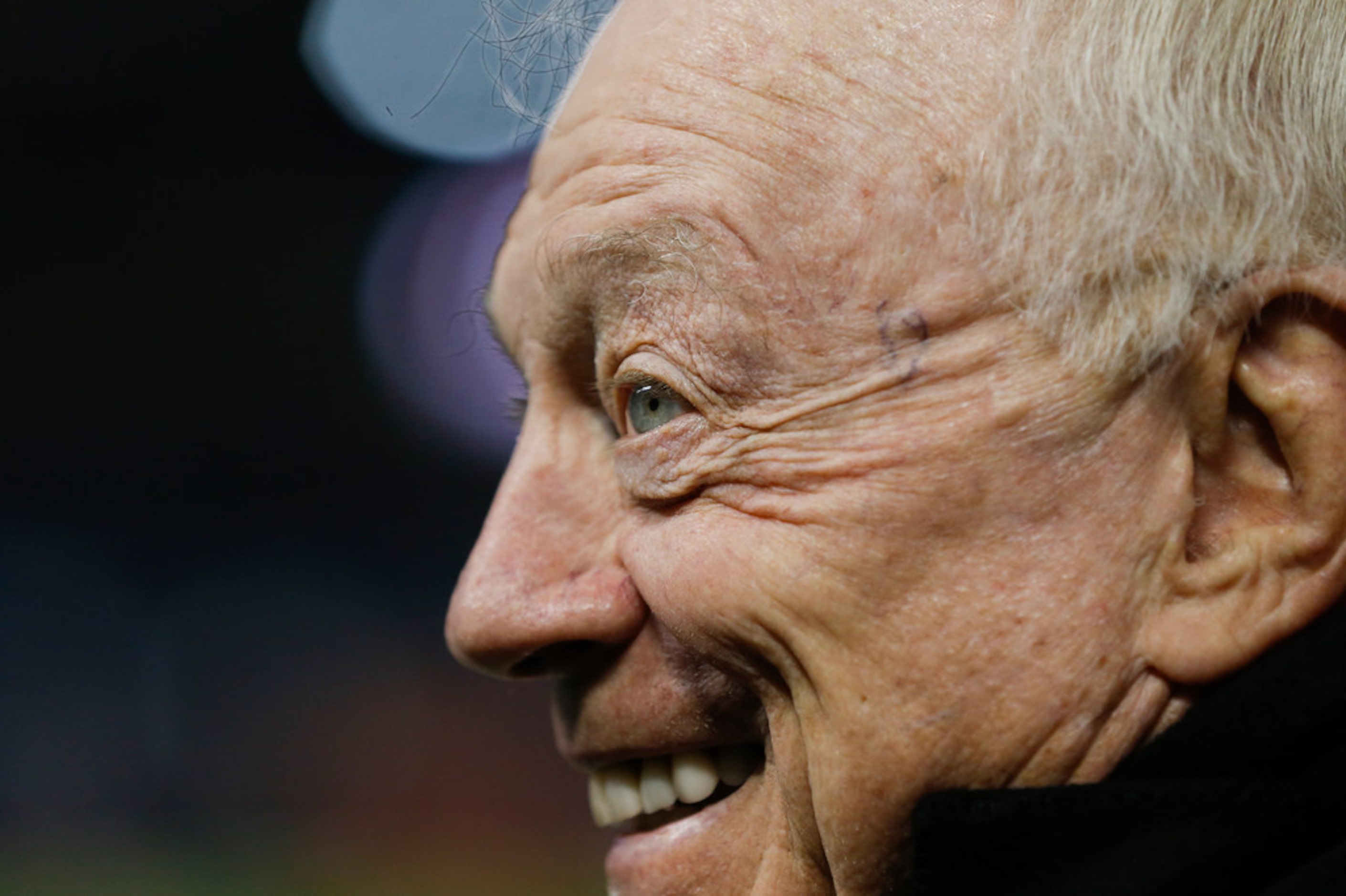 Dallas Cowboys owner Jerry Jones converses along the sidelines prior to a NFL matchup...