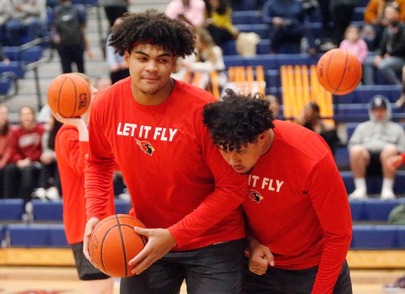 Melissa High School post Trevor Goosby (left) warms up with team mate Nigel Smith  before...