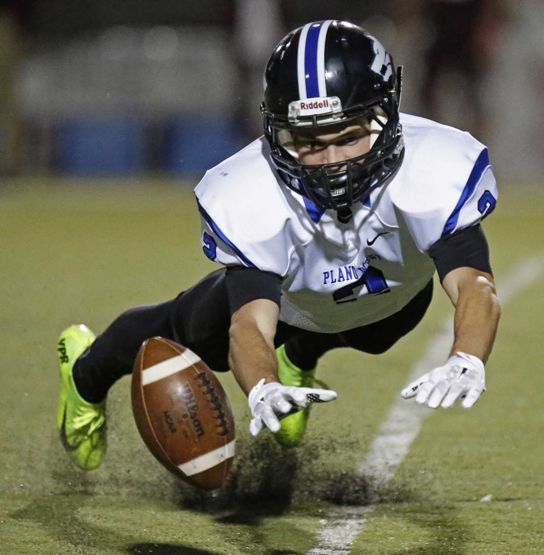 Plano West High School wide receiver Bennett Dubrow dives but couldn’t come up with the pass...