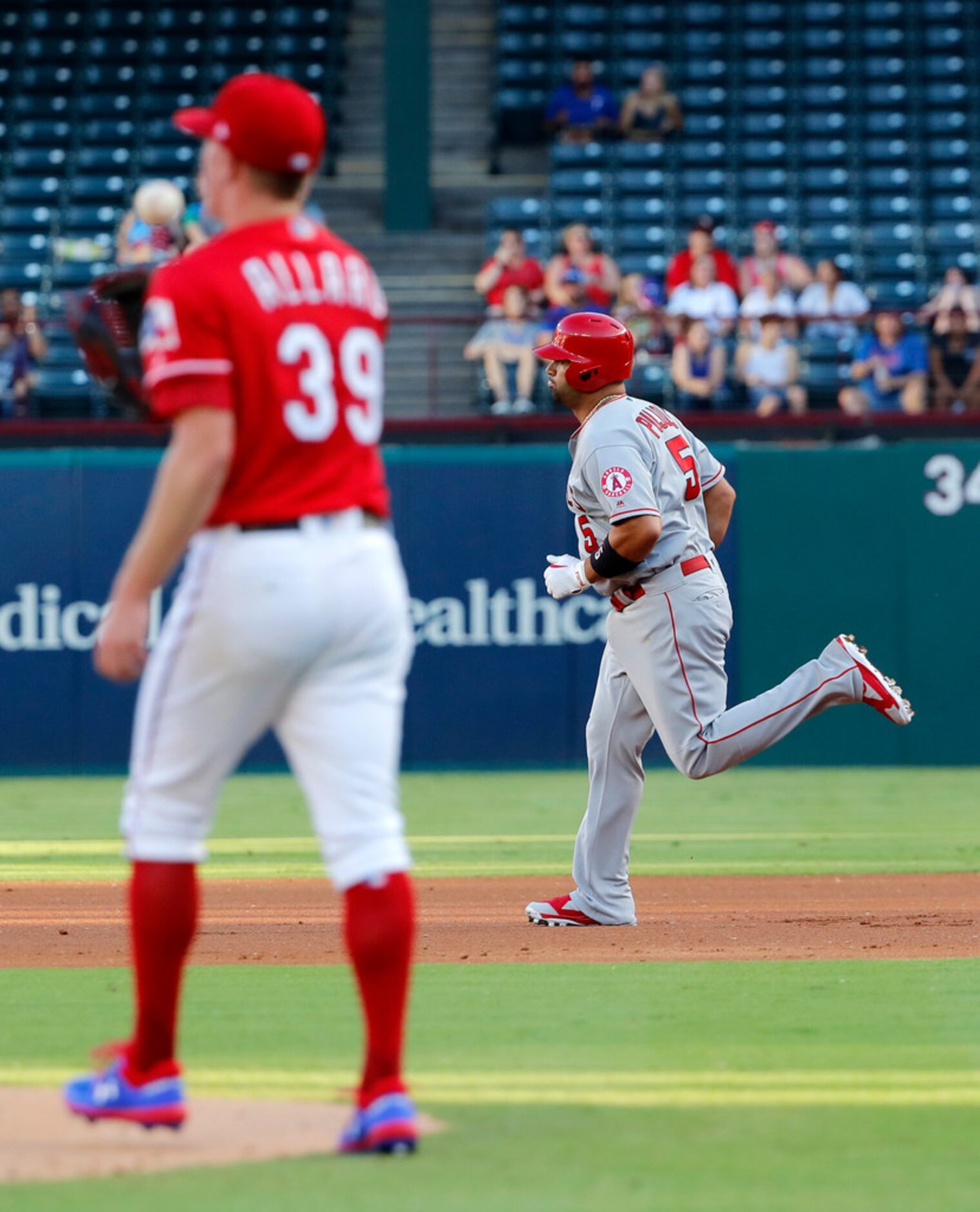 Texas Rangers relief pitcher Kolby Allard (39) walks back to the mound after giving up a...