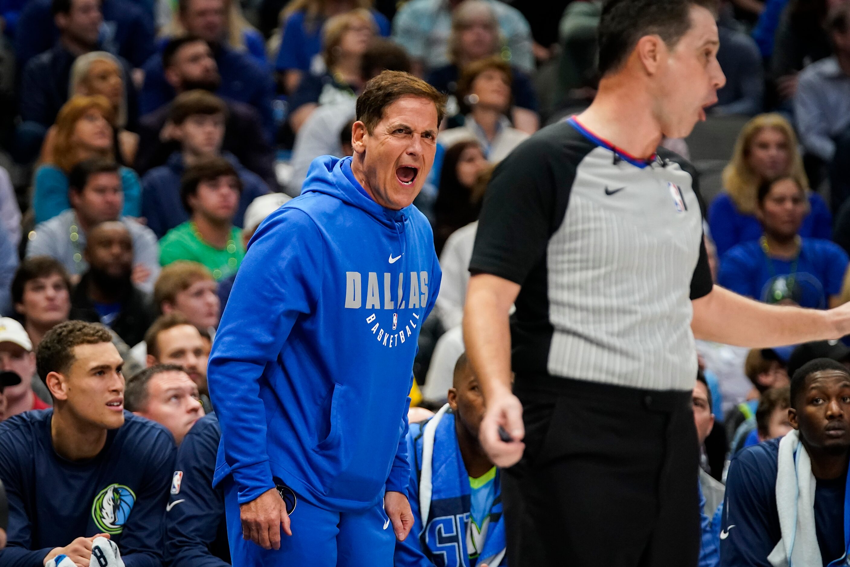 Dallas Mavericks owner Mark Cuban yells at an official during the first half of an NBA...