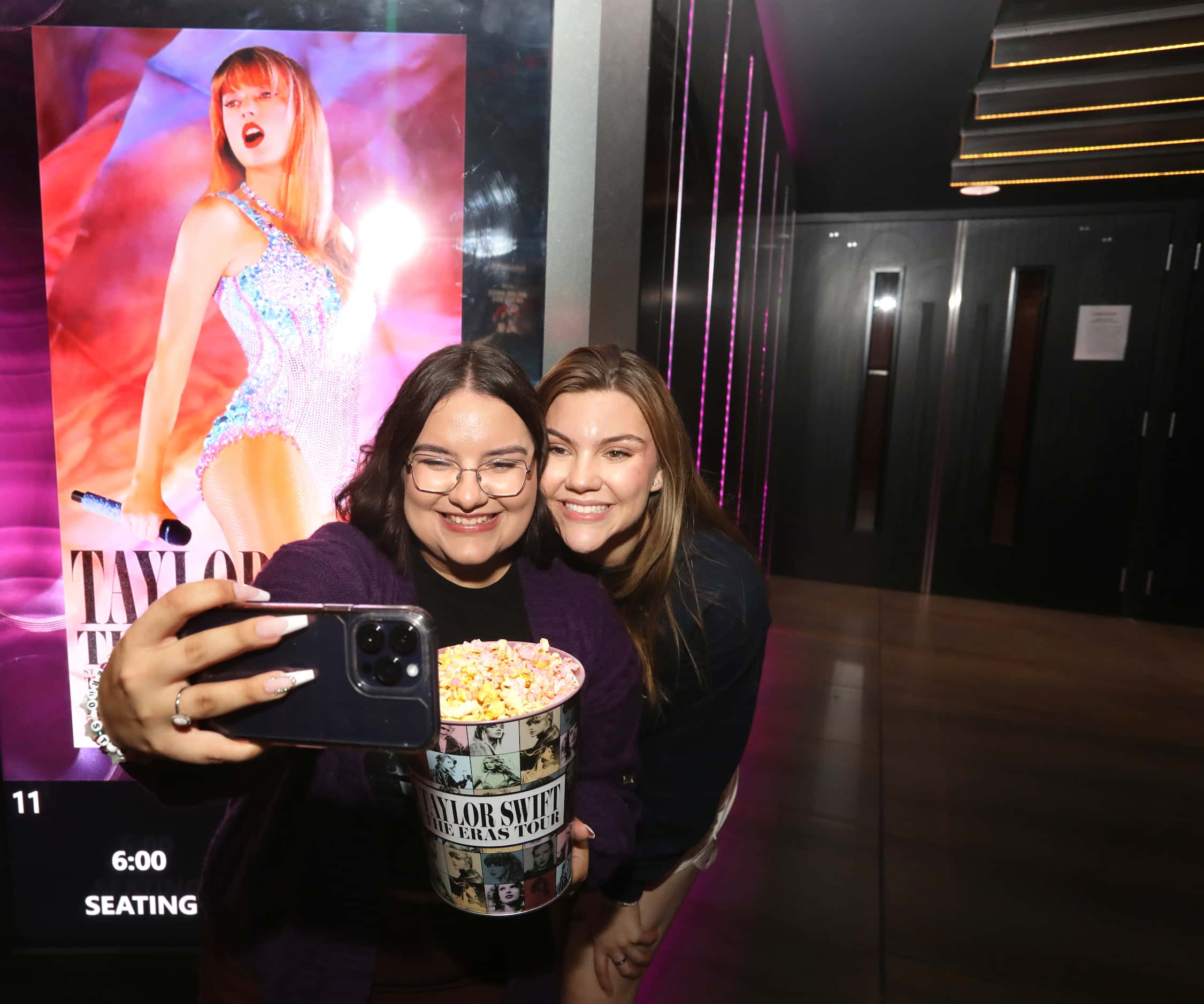 Ireland Davis and Bayleigh Coker take a selfie during Taylor Swift's new film at Cinemark...