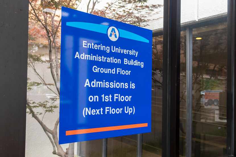 Signage displays the newly named University Administration Building, previously Davis Hall,...