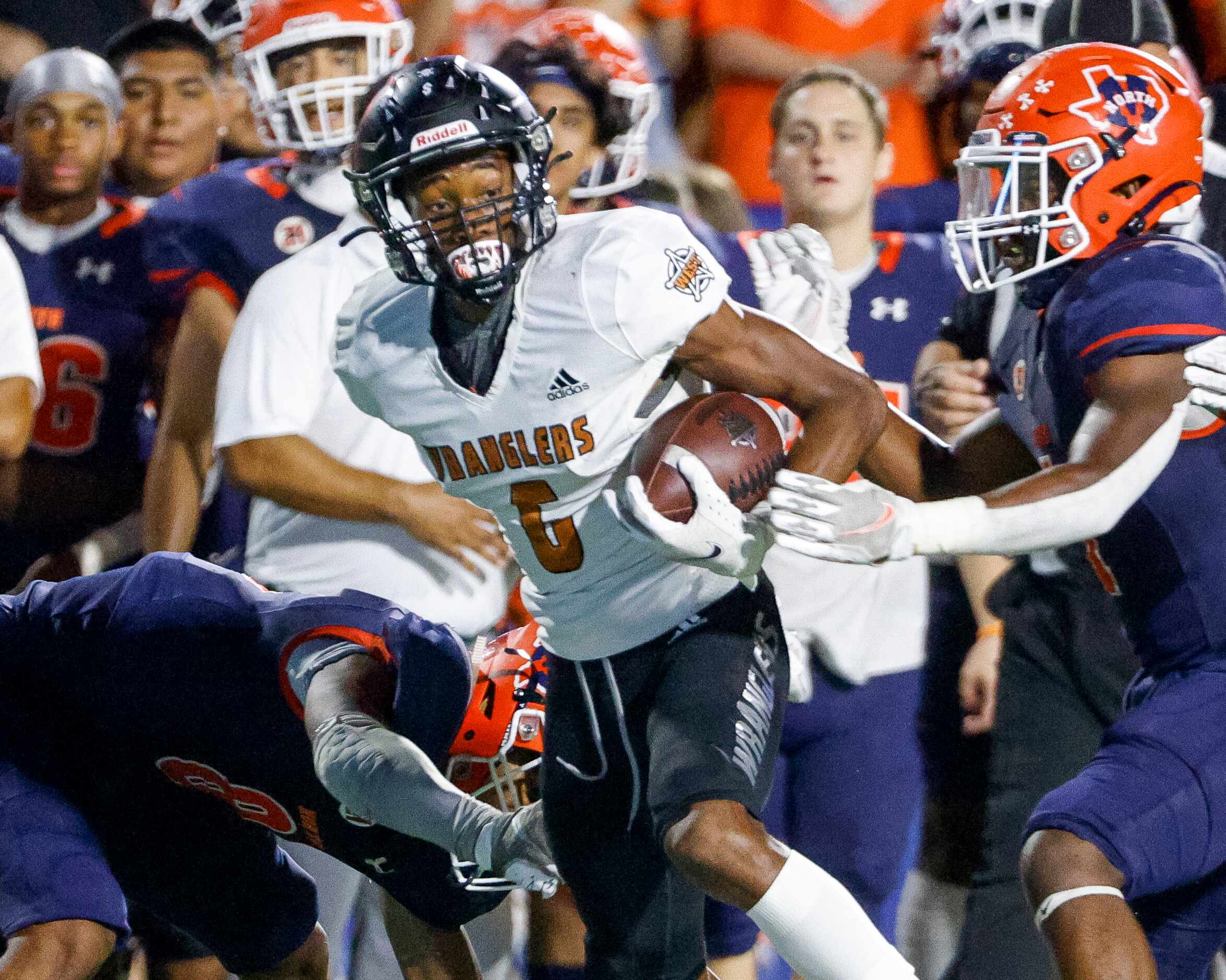 West Mesquite wide receiver Devin Duncan (6) evades the McKinney North defense during the...
