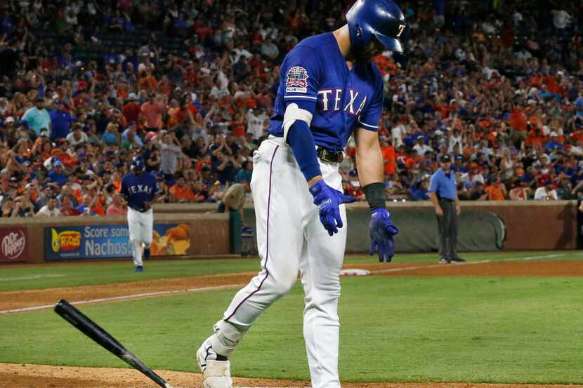 Texas Rangers center fielder Joey Gallo (13) reacts after striking out to end the eighth...