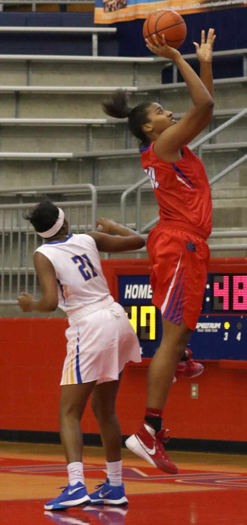Duncanville post Cierra Johnson (40) goes up for two points after moving inside of the...