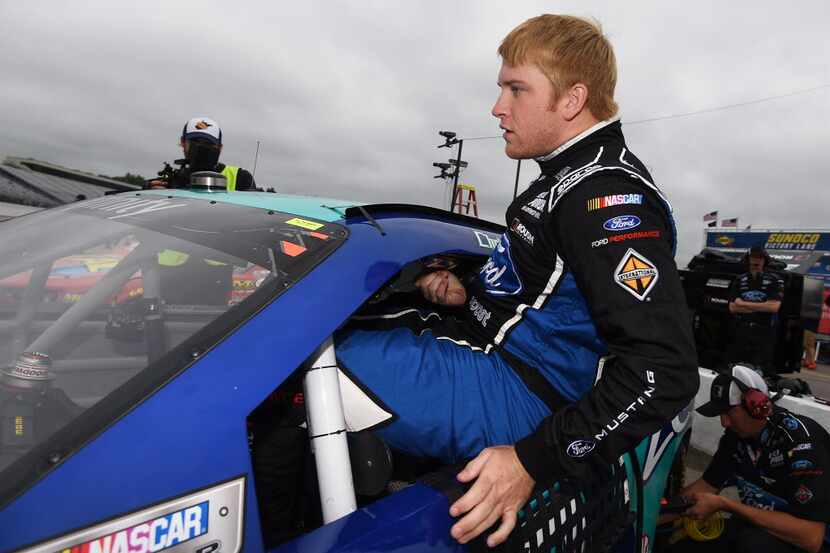 LOUDON, NH - JULY 18:  Chris Buescher, driver of the #60 Zest Ford, climbs into his car...