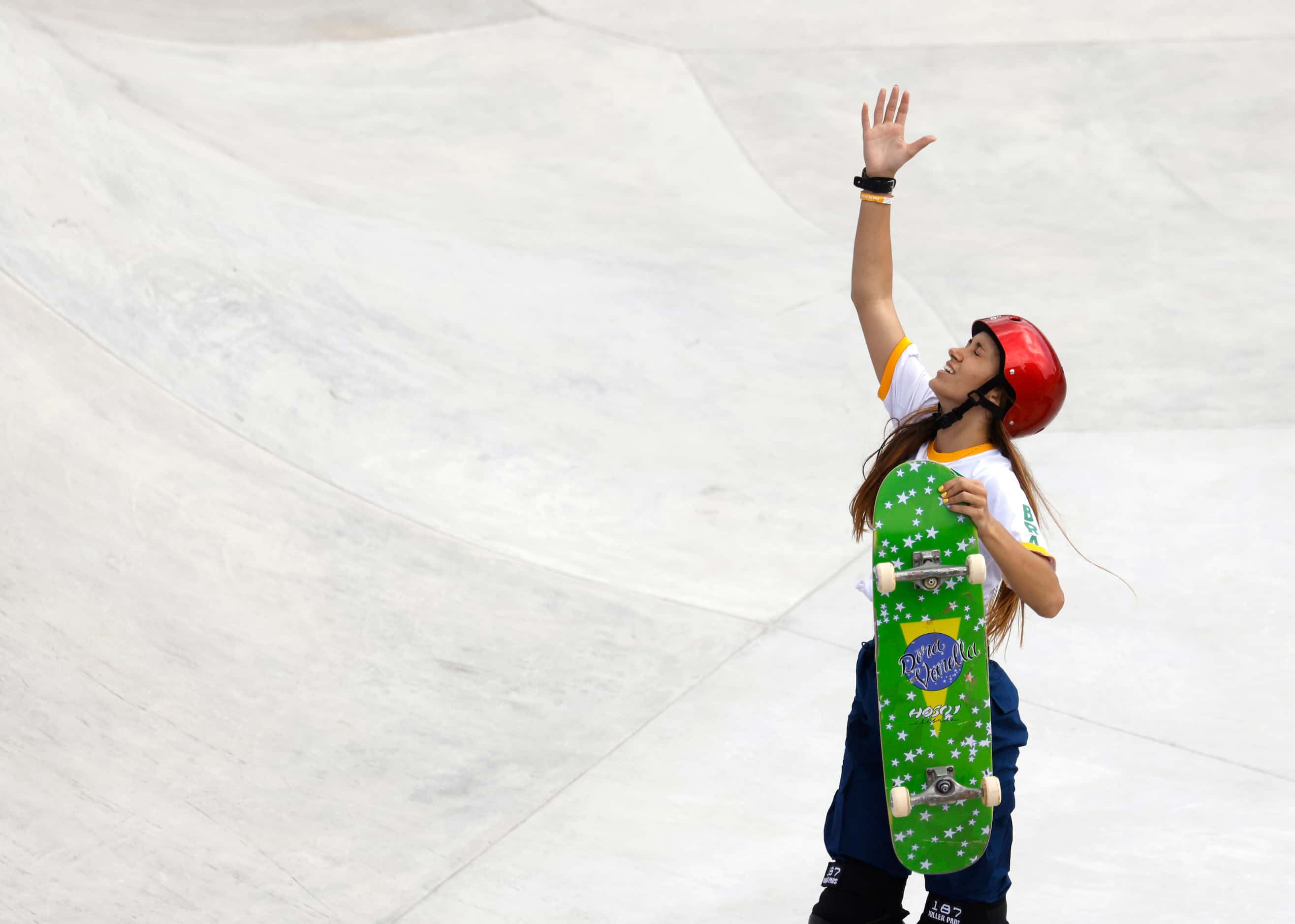 Brazil’s Dora Varella reacts after a run during the women’s skateboarding prelims at the...