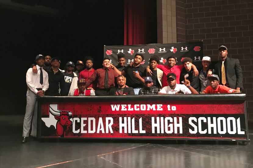 Cedar Hill football players pose for a group picture during the school's national signing...
