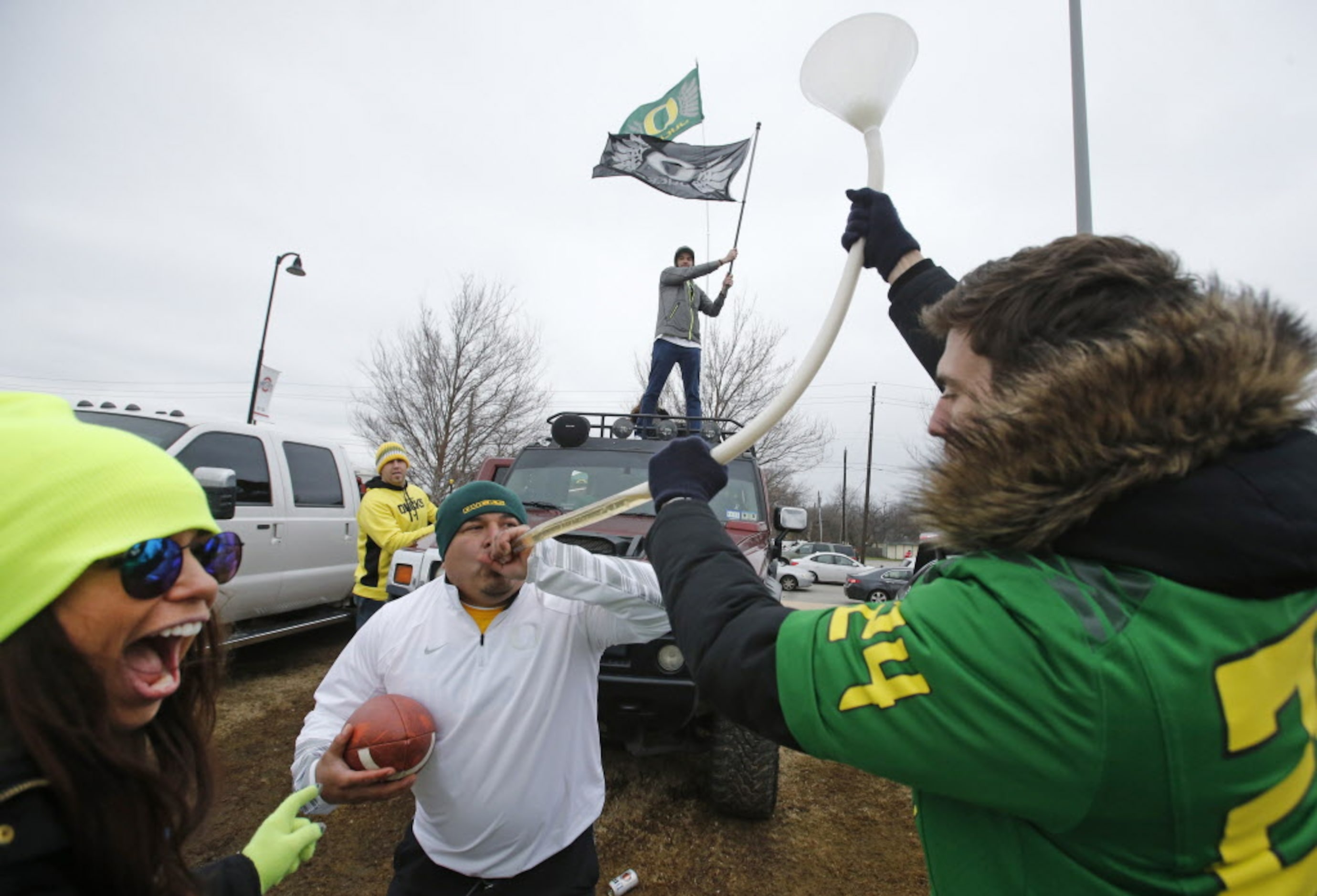 Ozzie Ahumada from Corpus Christi, Texas enjoys some liquid refreshment as he tailgates with...