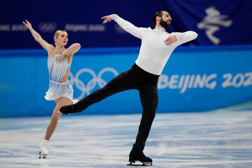 Ashley Cain-Gribble and Timothy Leduc, of the United States, compete in the pairs short...