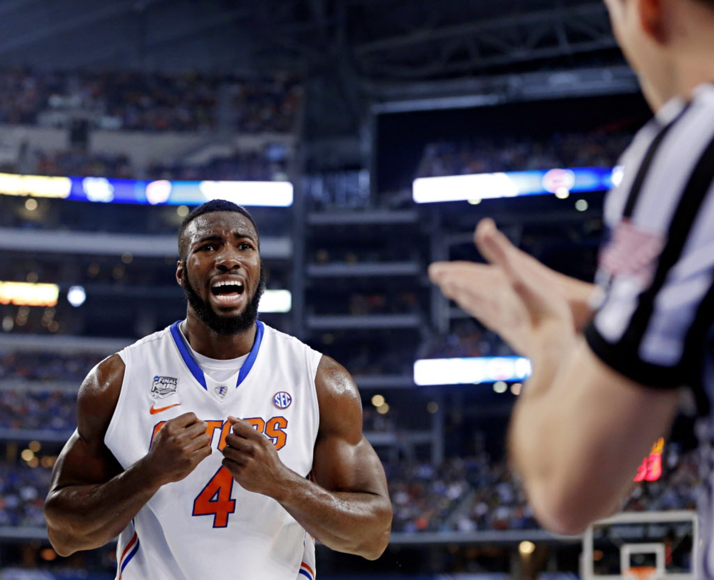 Florida Gators center Patric Young reacts to an official's call during the first half of...