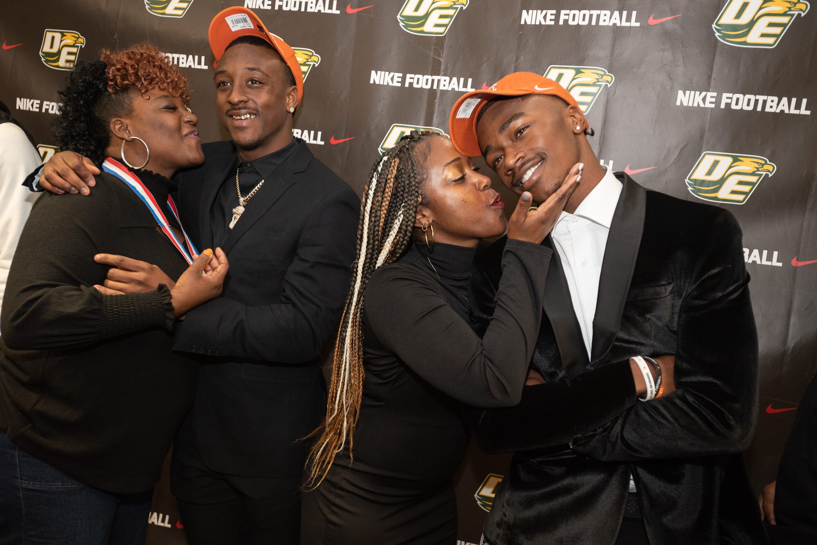 DeSoto high school football players, Tre Wisner, left, and Johntay Cook II, right, receive...