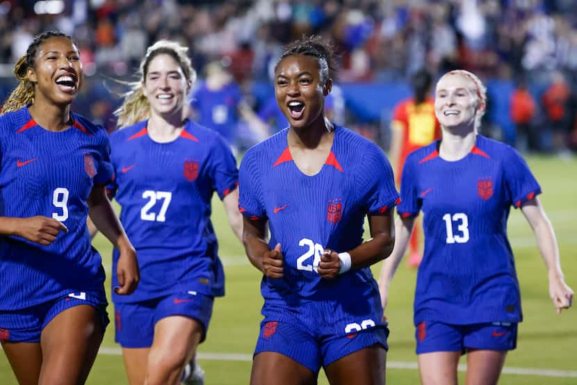 United States' Jaedyn Shaw (center right) celebrates her first international goal during the...