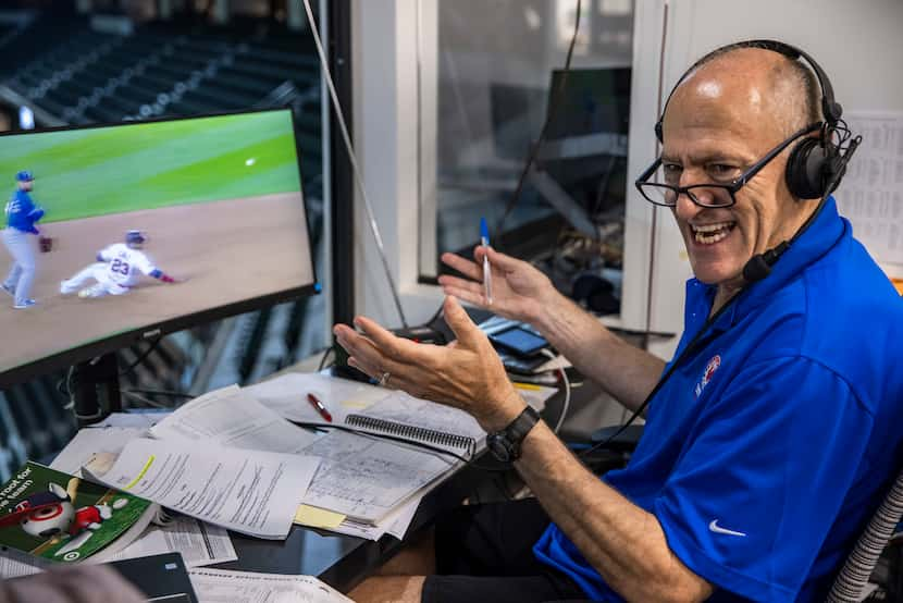 Texas Rangers broadcaster Eric Nadel laughs with fellow broadcaster Matt Hicks while...